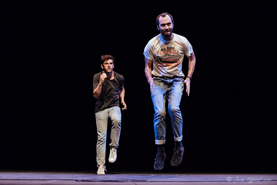 Bert and Nasi performing, jumping on stage